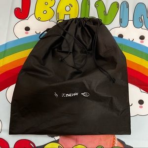 J. Balvin black dust bag